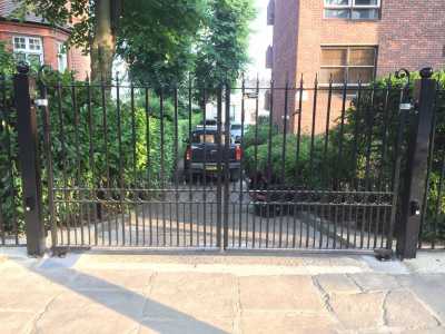 classic black wrought iron driveway gate